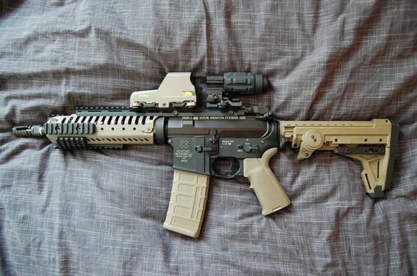 Noveske N4 Lower Receiver, VLTOR CASV ELT Rail System, VLTOR MUR-1 Upper Receiver, Magpul 93B Stock, Magpul MIAD Grip & Trigger Guard, EOTech 553 Tan with Aimpoint 3X Magnifier, Magpul PMAG, Troy Flashider